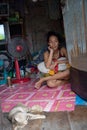 A woman living in a slum doing laundry